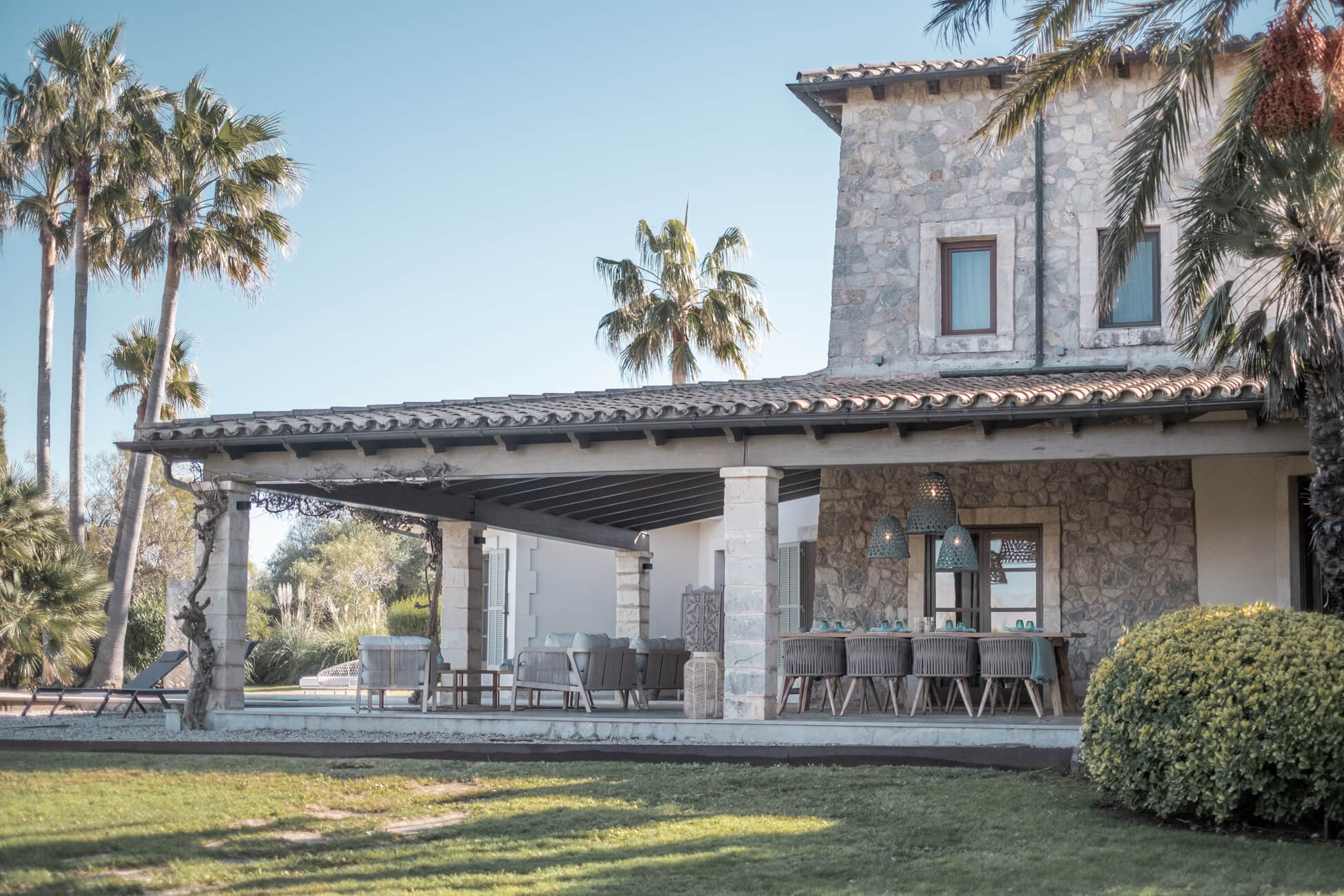 Dining terrace protected from the sun under a canopy